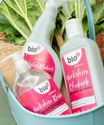 Bio D handwash, sanitiser and washing up liquid in Yorkshire rhubarb in a metal bucket with a piece of hessian and loose rhubarb