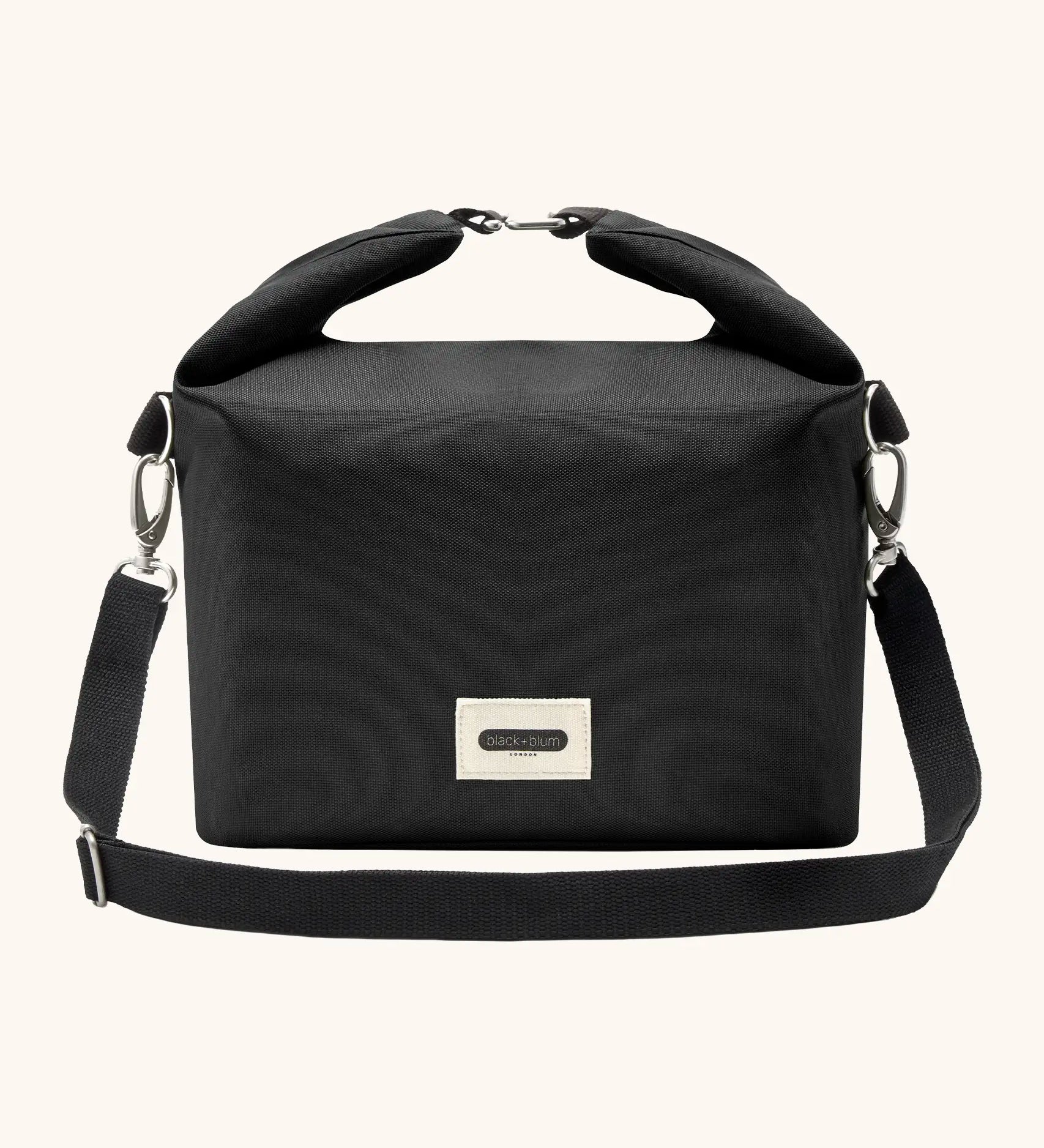 Black+Blum 10 litres insulated and water repellent roll top lunch bag in black with a hook buckle fastener and carry strap