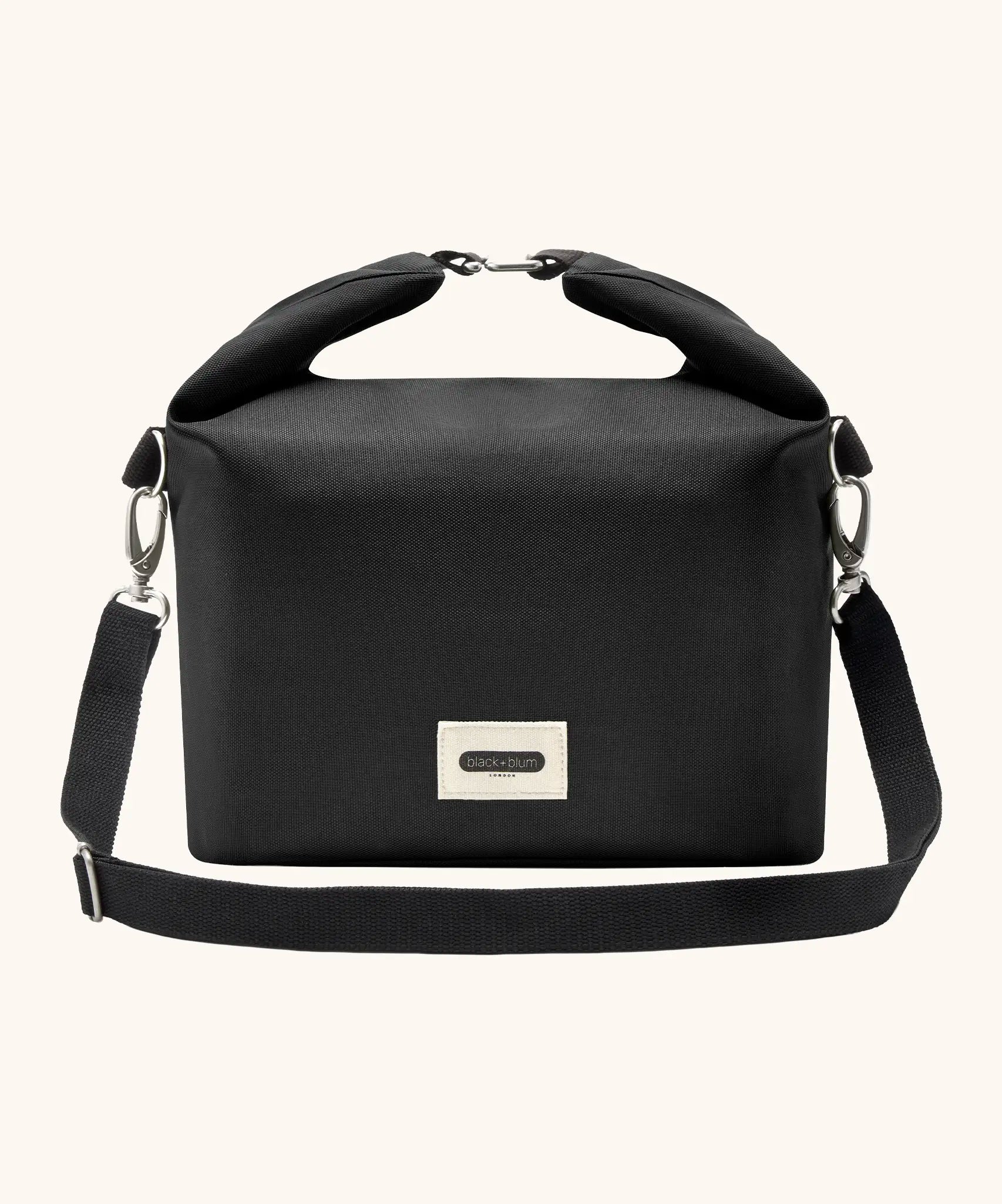 Black+Blum 10 litres insulated and water repellent roll top lunch bag in black with a hook buckle fastener and carry strap