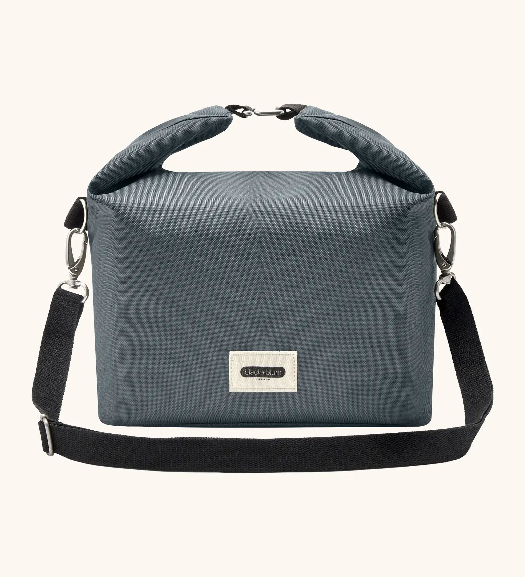 Black+Blum 10 litres insulated and water repellent roll top lunch bag in slate blue with a hook buckle fastener and carry strap