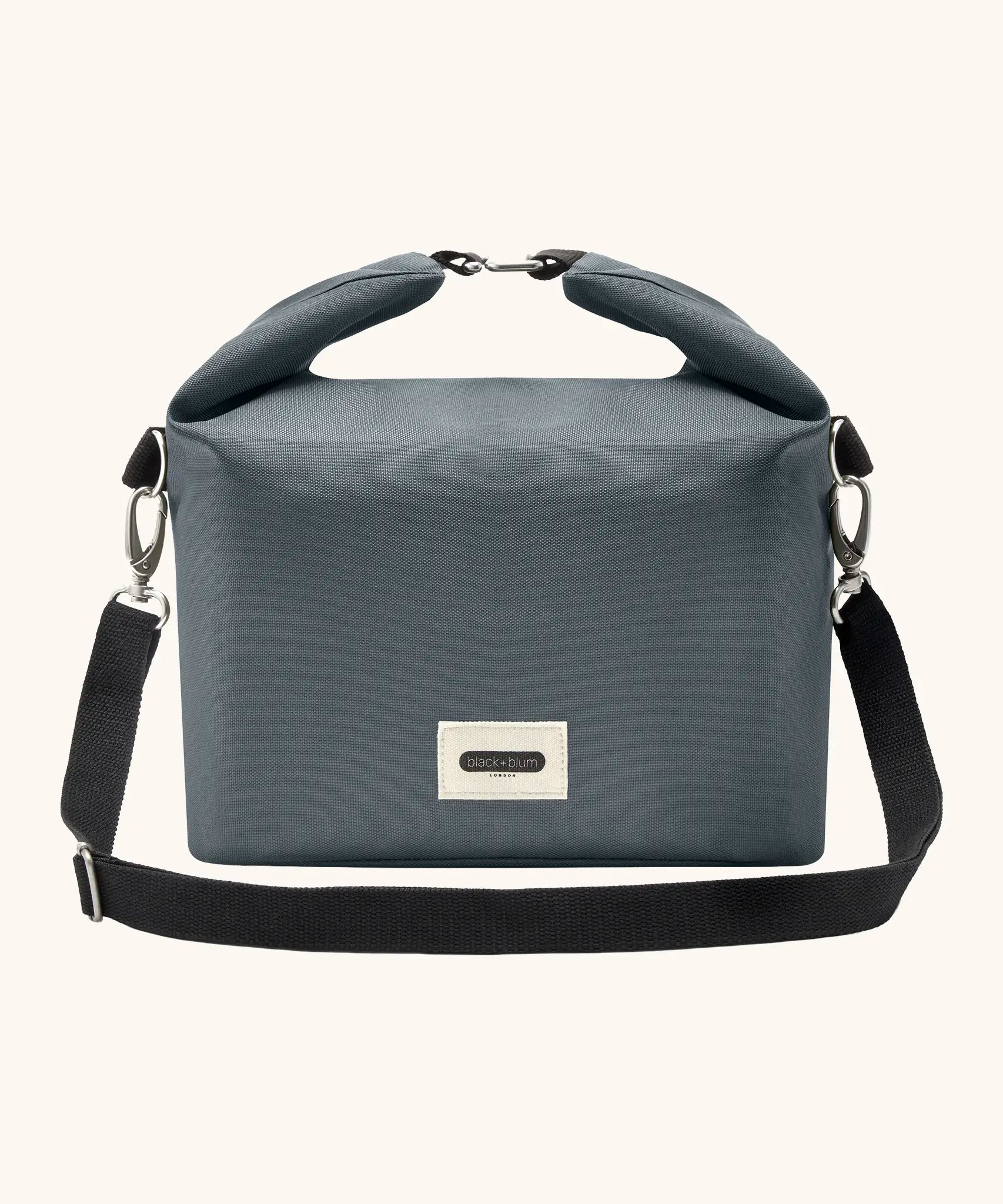 Black+Blum 10 litres insulated and water repellent roll top lunch bag in slate blue with a hook buckle fastener and carry strap