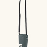 Black + Blum insulated water repellent bottle bag in slate blue showing the carry strap fully extended
