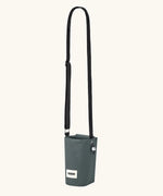 Black + Blum insulated water repellent bottle bag in slate blue showing the carry strap fully extended
