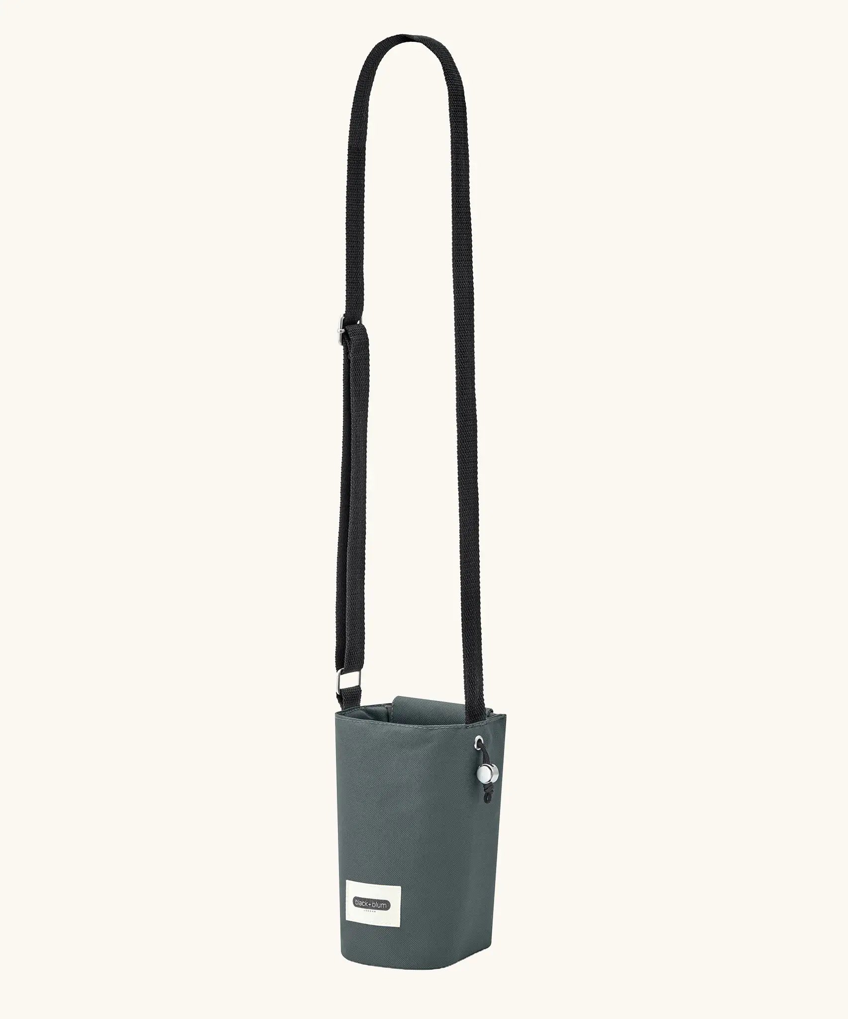 Black + Blum insulated water repellent bottle bag in slate blue showing the carry strap fully extended