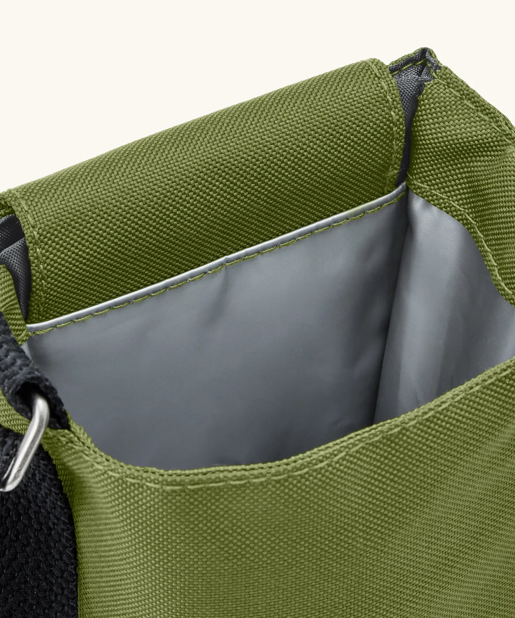Black + Blum insulated bottle bag in moss green showing a close up of the insulated lining material on the inside