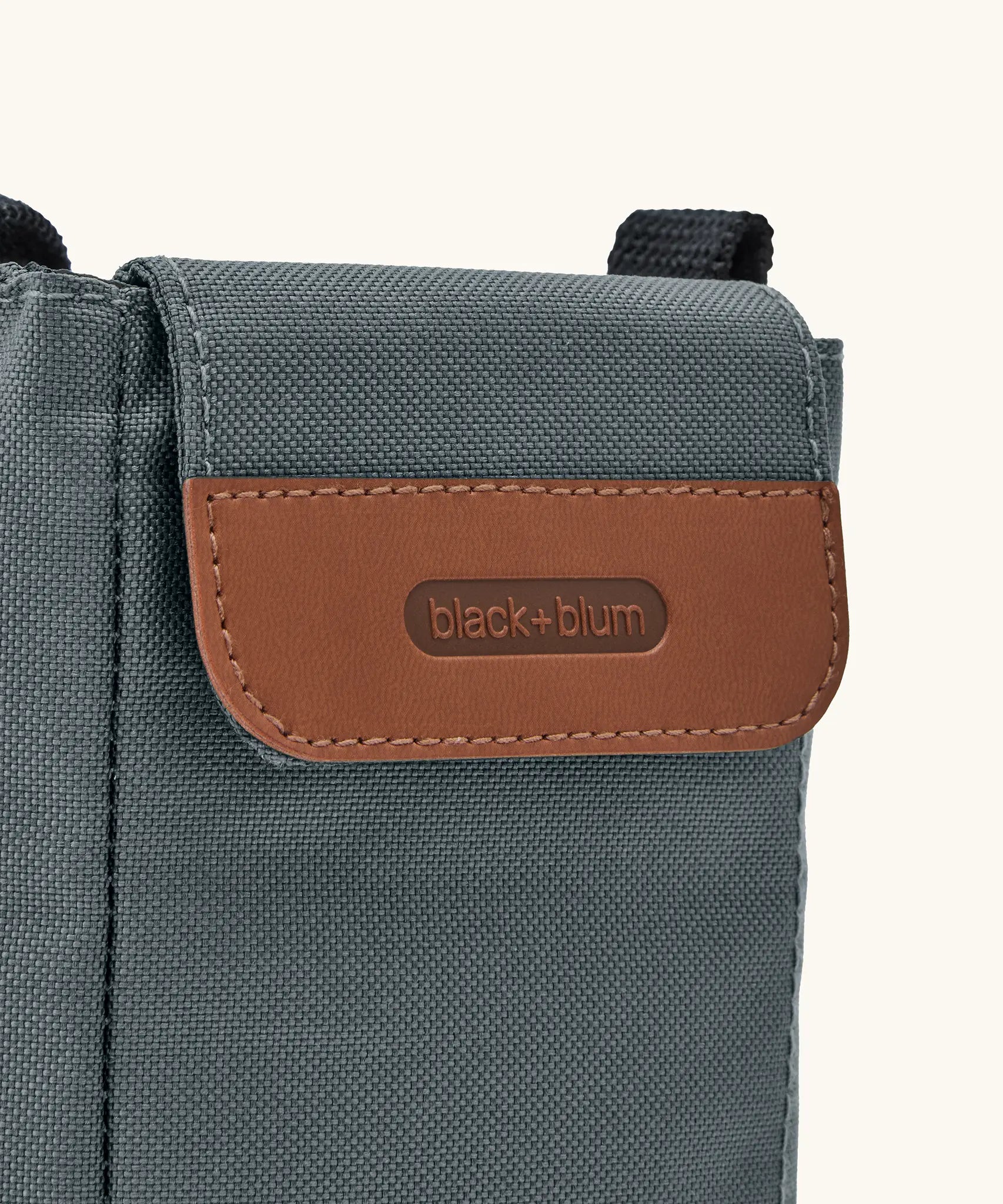 Black + Blum insulated bottle bag in slate blue showing a close up of the velcro flip lid