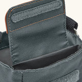 Black + Blum insulated bottle bag in slate blue showing a close up of the velcro flip lid open revealing a compartment