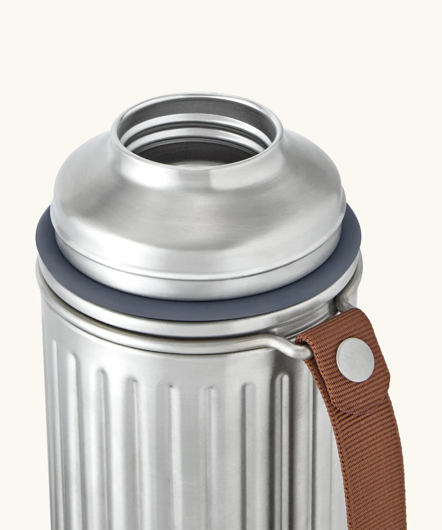 An open Black&Blum leakproof duo explorer flask showing the silicone gasket and brown nylon carry handle