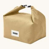 Black+Blum 7 litres insulated and water repellent roll top lunch bag in clay beige standing on an angle