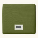 A moss green Black+Blum 7 litres insulated and water repellent roll top lunch bag folded neatly into a square