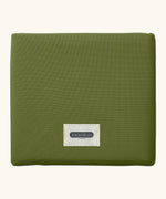 A moss green Black+Blum 7 litres insulated and water repellent roll top lunch bag folded neatly into a square