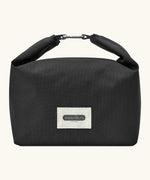 Black+Blum 7 litres insulated and water repellent roll top lunch bag in black with a hook buckle fastener