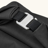 Close up the metal hook buckle fastener for the Black+Blum roll top lunch bag in black 