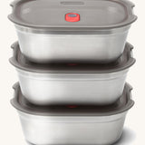 A stack of the stainless steel Black + Blum leakproof lunchboxes.