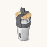 A set of 4 Black + Blum stainless steel cups. Features a handy black carry strap and a protective Bamboo lid 