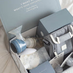 The contents of the Lola & Lykke Breastfeeding Starter Kit, shown inside its box