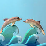 Bumbu Wooden Dolphin.  The toy is paired with another dolphin riding waves together.
