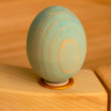 Bumbu wooden blue egg decorative figure standing in a celebration ring