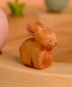 Bumbu wooden brown bunny decorative figure standing in a celebration ring