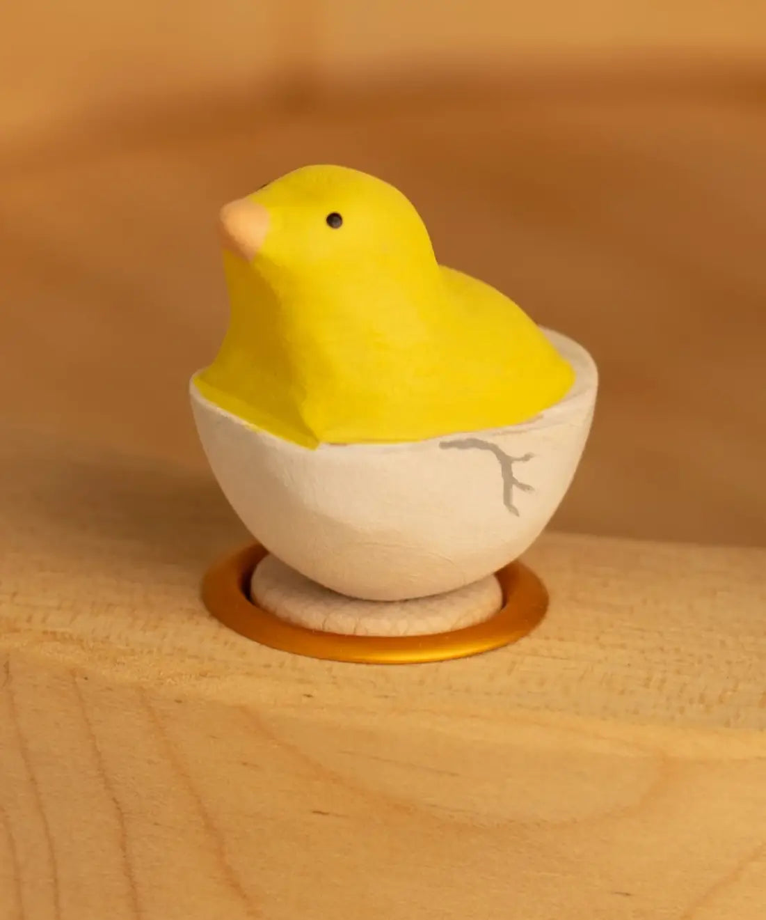 Bumbu wooden yellow chick in egg decorative figure standing in a celebration ring