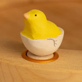 Bumbu wooden yellow chick in egg decorative figure standing in a celebration ring