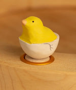 Bumbu wooden yellow chick in egg decorative figure standing in a celebration ring
