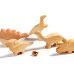 Bumbu childrens handmade natural wooden dinosaur toy figures on a white background