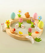 A Easter inspired celebration ring showing different wooden decorative figures including eggs, rabbits and flowers