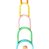 Bumbu pastel wooden arches stacked in a tower on a white background