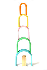 Bumbu pastel wooden arches stacked in a tower on a white background