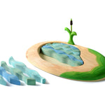 Bumbu wooden lake and cattail puzzle pieces scattered on a white background