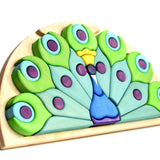 Bumbu eco-friendly plastic free wooden peacock shape puzzle stood up on a white background