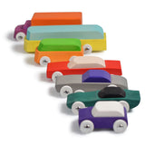 Collection of Bumbu eco-friendly wooden car toys laid out in a line on a white background