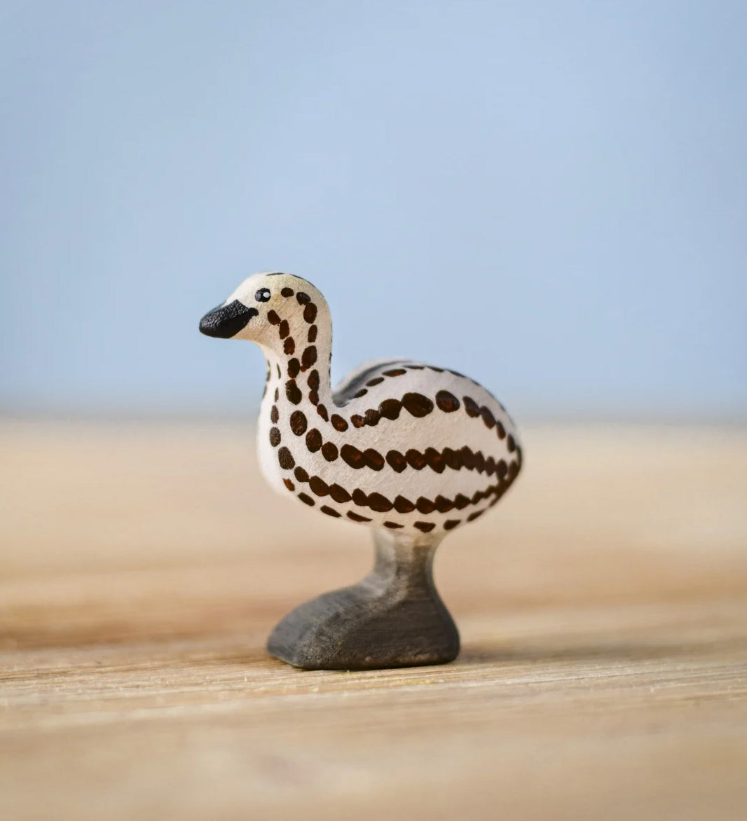 Bumbu wooden emu chick figure standing on a wooden board