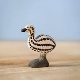 Bumbu wooden emu chick figure standing on a wooden board