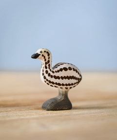 Bumbu wooden emu chick figure standing on a wooden board