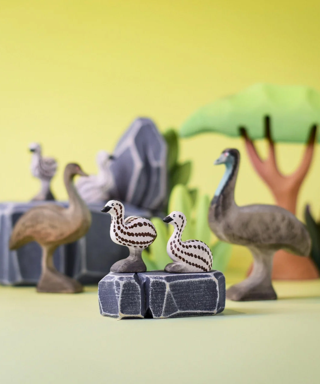 A play scene featuring a family of Bumbu wooden emu's 