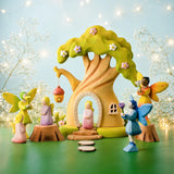 A fairytale inspired playscene showing the Bumbu wooden fairy treehouse and fairy figures 