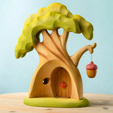 Bumbu toys handcrafted fairy treehouse showing hollow back, removable door and a hanging lantern