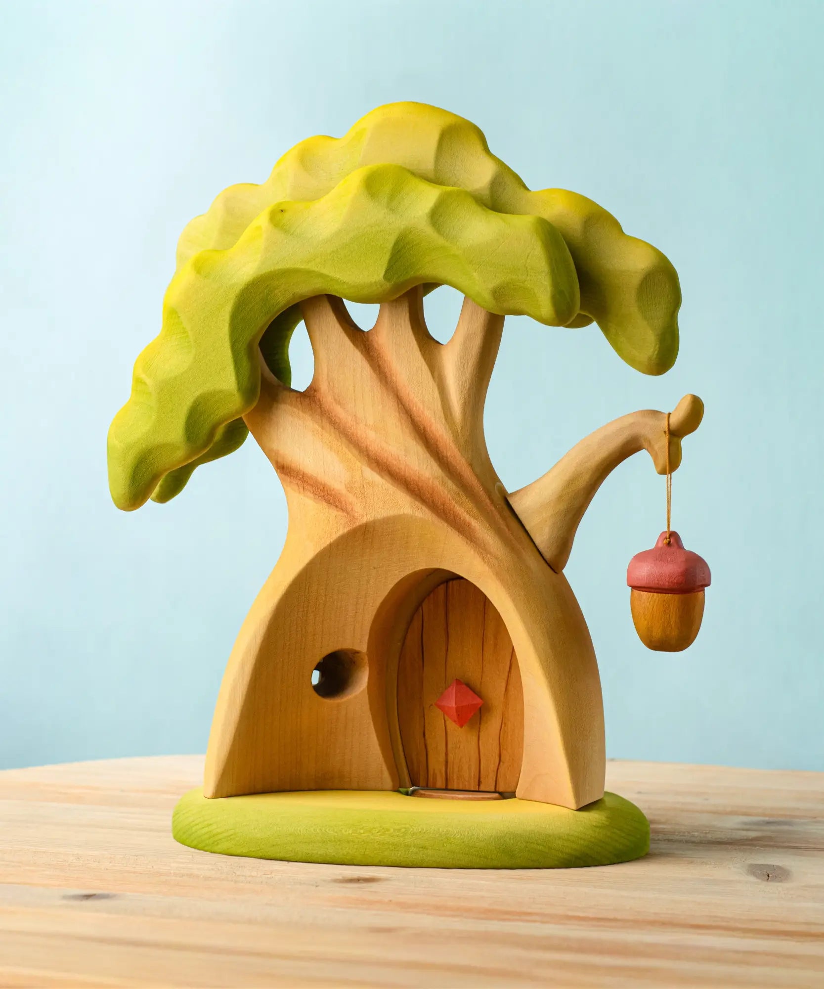 Bumbu toys handcrafted fairy treehouse showing hollow back, removable door and a hanging lantern