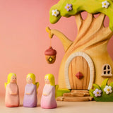 Bumbu wooden fairy figures standing in front of the fairy treehouse set 