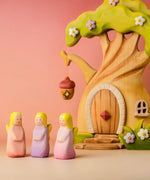 Bumbu wooden fairy figures standing in front of the fairy treehouse set 