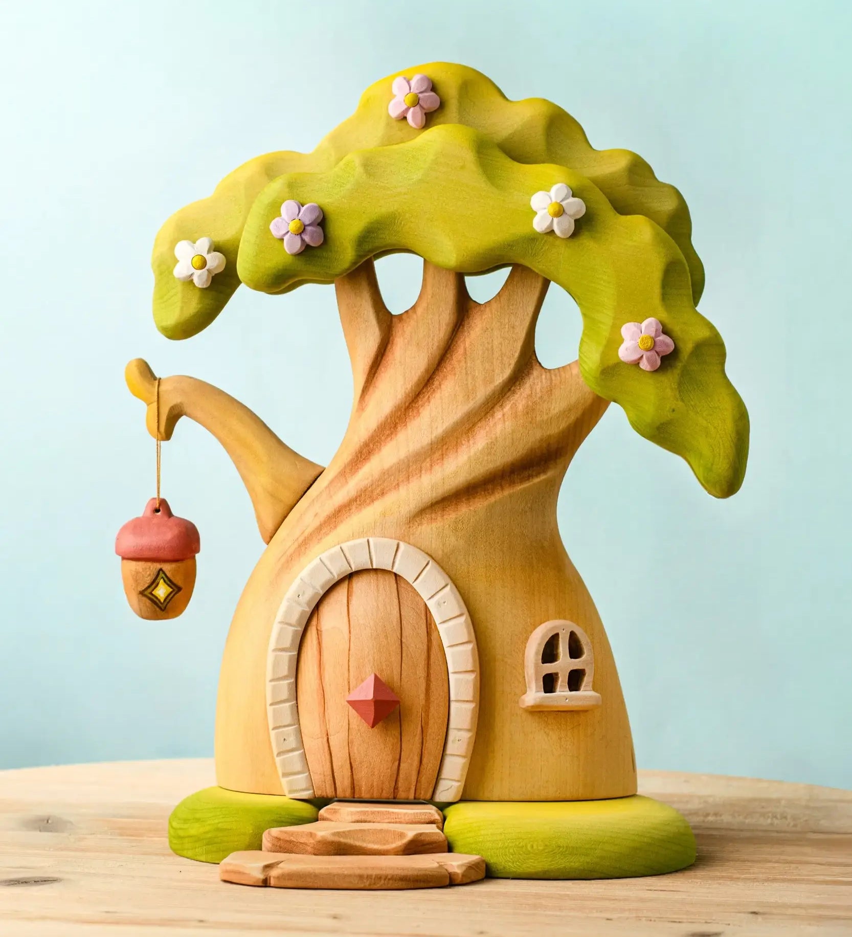 Bumbu toys handcrafted wooden fairy treehouse with a hanging lantern and a removable door