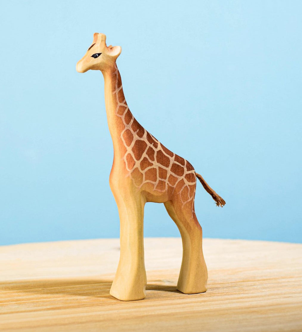The Bumbu wooden female giraffe toy figure, hand carved and painted.