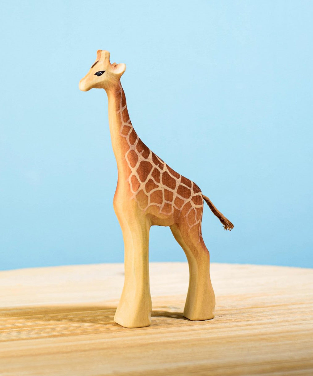 The Bumbu wooden female giraffe toy figure, hand carved and painted.