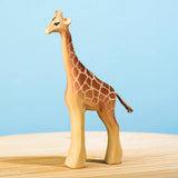 The Bumbu wooden female giraffe toy figure, hand carved and painted.