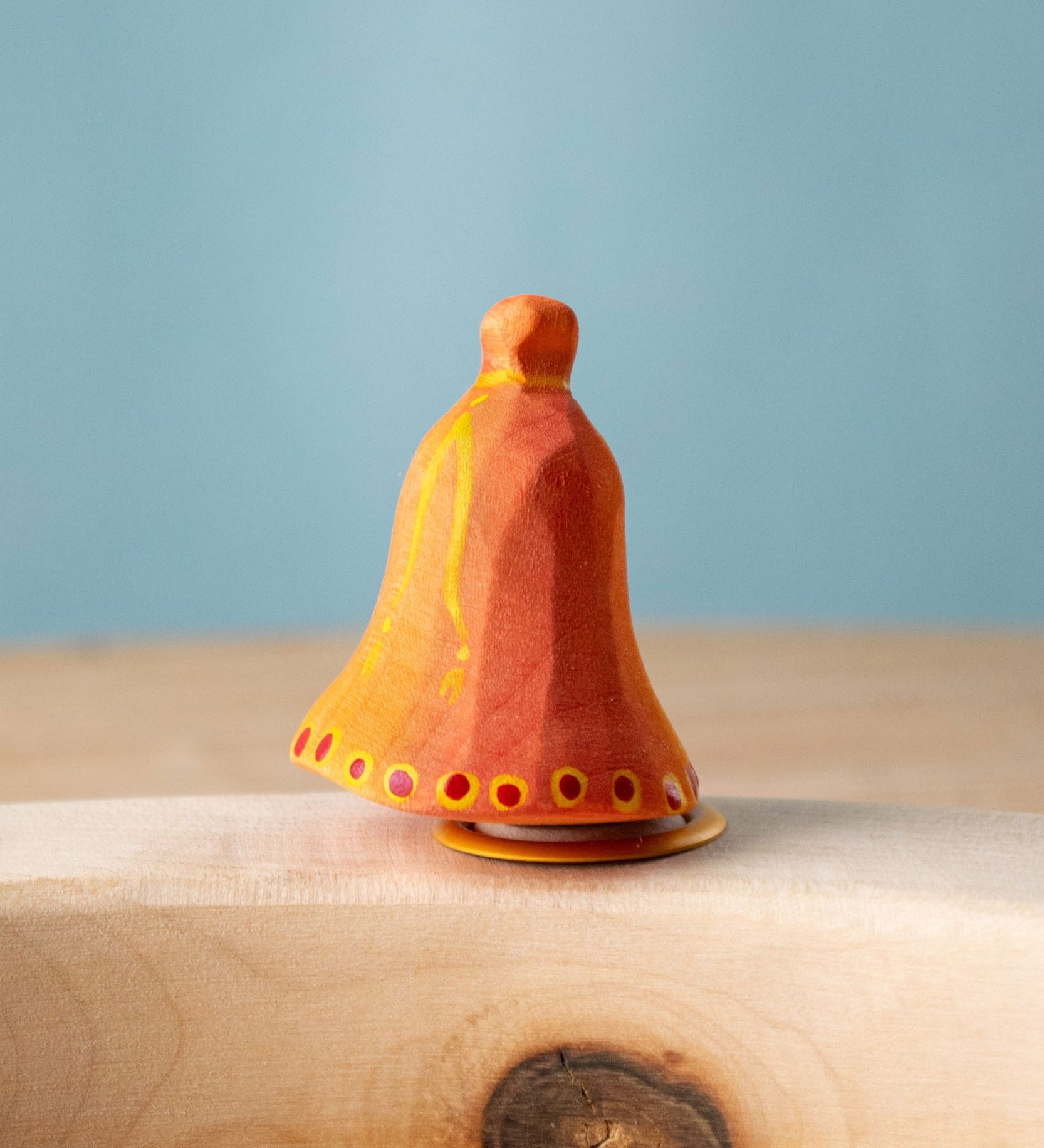 Bumbu Festive Bell Celebration decorative Figure to fit on a Grimm's celebration ring. These festive figures are perfect for your Christmas celebration ring set up. These expertly hand crafted items are part of a large range of wooden toys available here at Babipur. 