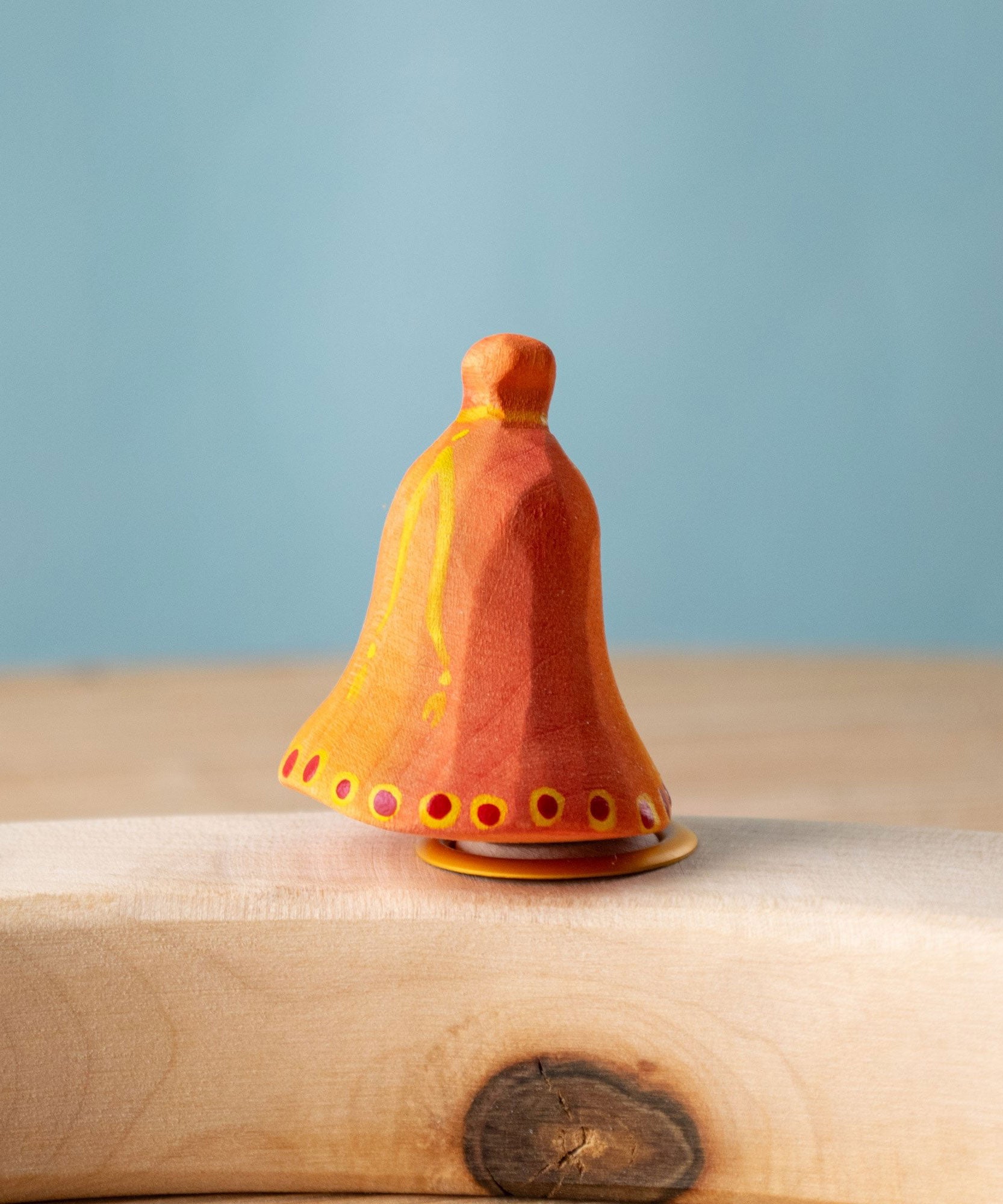 Bumbu Festive Bell Celebration decorative Figure to fit on a Grimm's celebration ring. These festive figures are perfect for your Christmas celebration ring set up. These expertly hand crafted items are part of a large range of wooden toys available here at Babipur. 