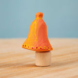 Bumbu Festive Bell Celebration decorative Figure to fit on a Grimm's celebration ring. These festive figures are perfect for your Christmas celebration ring set up. These expertly hand crafted items are part of a large range of wooden toys available here at Babipur. 