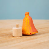 Bumbu Festive Bell Celebration decorative Figure to fit on a Grimm's celebration ring. The figure is shown with the bell seperate from the base. These festive figures are perfect for your Christmas celebration ring set up. These expertly hand crafted items are part of a large range of wooden toys available here at Babipur. 